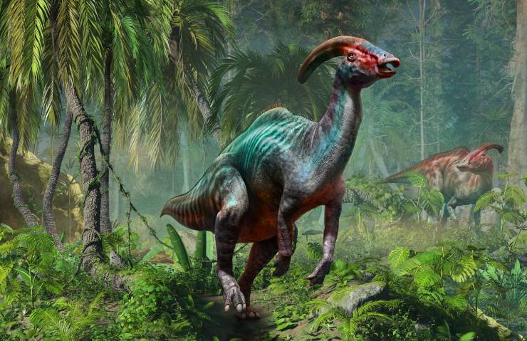 An 3D illustration image of 2 dinosaurs with green, red, orange, grey, etc. They run in the jungle that cover with big, long green vines and trees and grey stones. The crest was shaped like a long, backward-curving tube that extended from the top of its head to the back of its neck.had a long, flat beak with small teeth at the front of its mouth. Its body was large and bulky, with a barrel-shaped ribcage and four sturdy legs