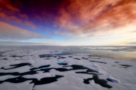 A photo of Antarctica showed a huge ice sheet melting and the sky was orange, blue and light grey.