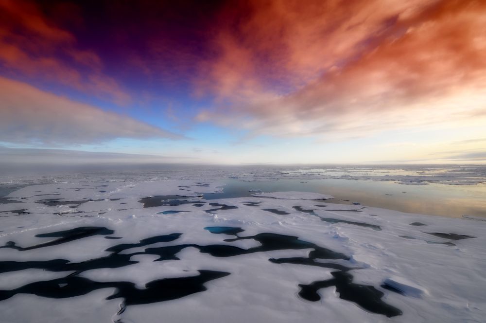 A photo of Antarctica showed a huge ice sheet melting and the sky was orange, blue and light grey.